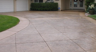 Brown stained and stamped concrete driveway.