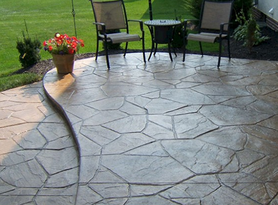 Brown stamped stone style concrete patio.