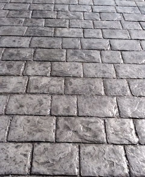 Worn and weathered stamped concrete.