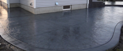 Gray stained and polished concrete patio.